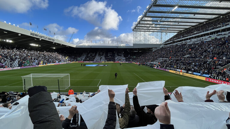 fans holding up black white sheets sjp newcastle united nufc 1120 768x432 1