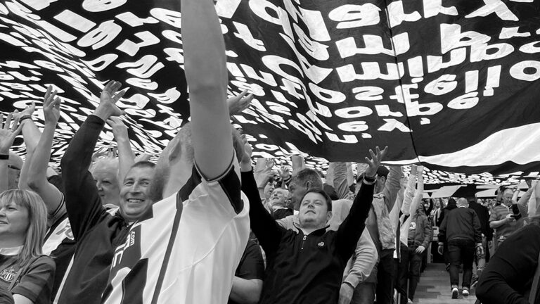 fans under the surfer flag leazes end newcastle united nufc bw 1120 768x432 1
