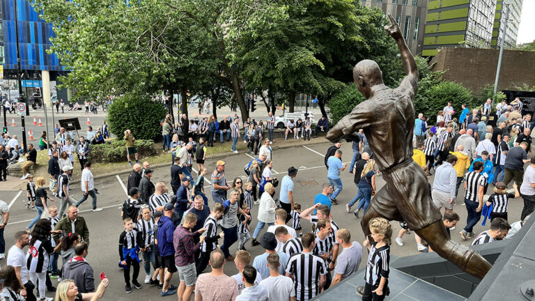fans looking up at alan shearer statue matchday sjp newcastle united nufc 1120 768x432 1