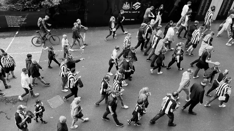 fans walking towards milburn stand from above matchday sjp newcastle united nufc bw 1120 768x432 1