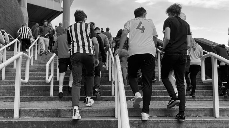 fans walking up stairs to gallowgate end sjp matchday newcastle united nufc bw 1120 768x432 1