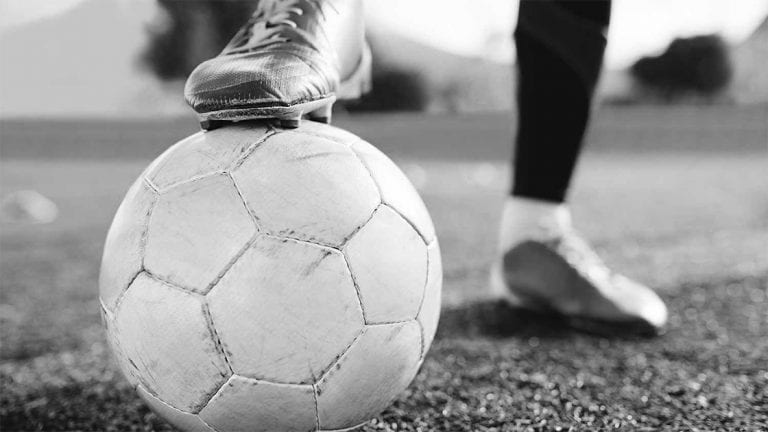 foot on top of football close up newcastle united nufc bw 1120 768x432 1