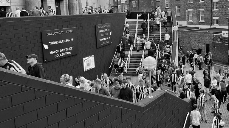 fans walking up stairs to gallowgate corner sjp matchday newcastle united nufc bw 1120 768x432 1