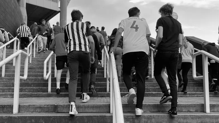 fans walking up stairs to gallowgate end sjp matchday newcastle united nufc bw 1120 768x432 1