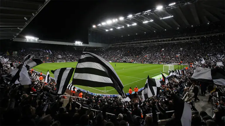 flag waving fans before game night match sjp newcastle united nufc 1120 768x432 1